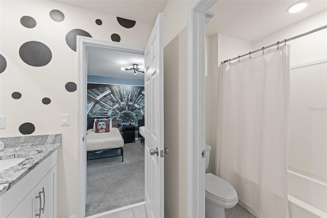 bathroom with vanity, visible vents, toilet, connected bathroom, and shower / tub combo