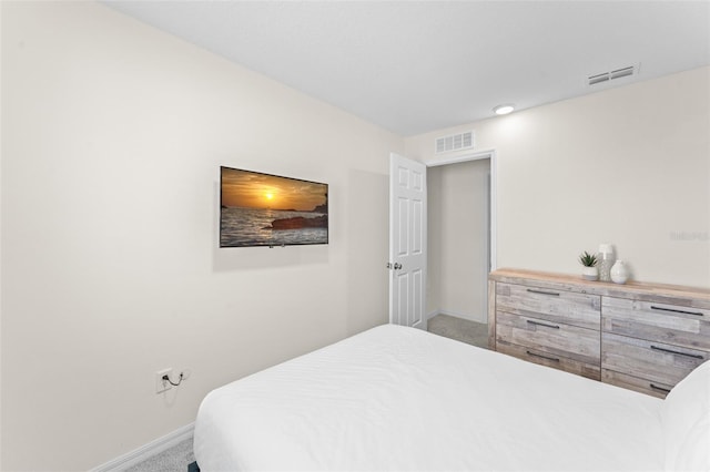 bedroom featuring visible vents, baseboards, and carpet floors