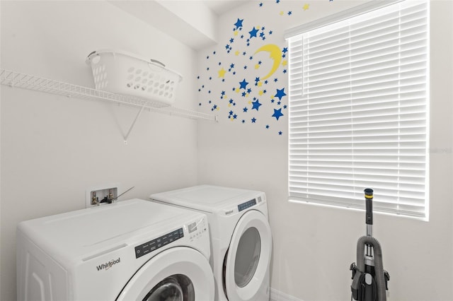 washroom with separate washer and dryer and laundry area