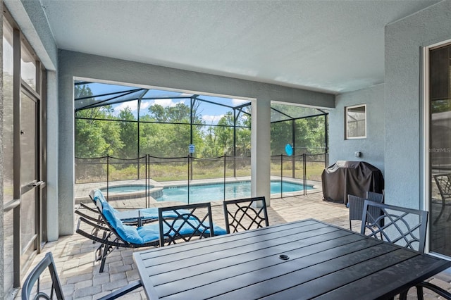 sunroom / solarium featuring plenty of natural light, a swimming pool, outdoor dining space, and a hot tub