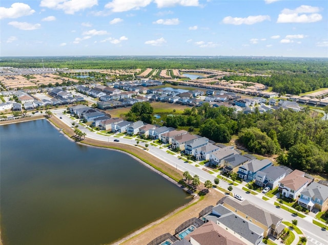 bird's eye view with a water view and a residential view