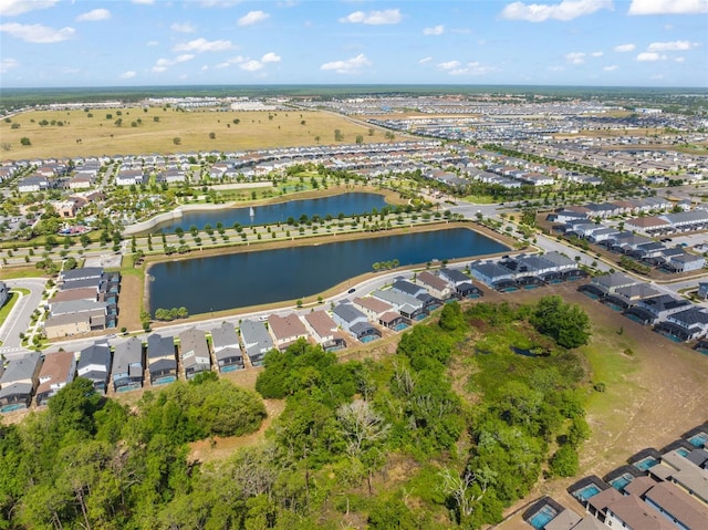 bird's eye view featuring a residential view and a water view
