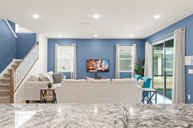 2009 Tropical Palms Cir, Kissimmee, FL 34747 - living room featuring recessed lighting and stairs