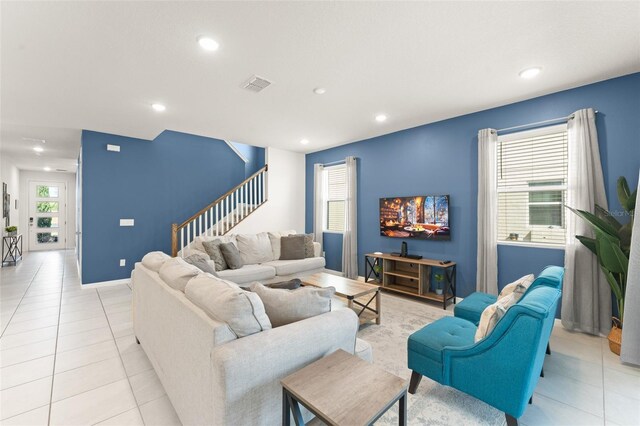 2009 Tropical Palms Cir, Kissimmee, FL 34747 - living room featuring stairs, recessed lighting, light tile patterned floors, and baseboards