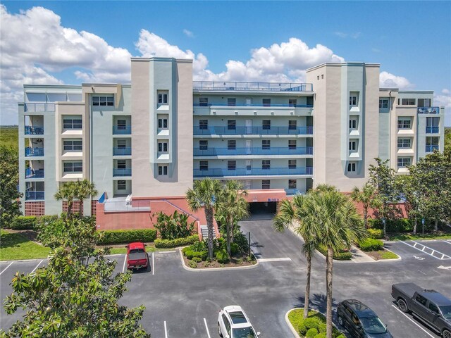 5300 S Atlantic Ave Unit 9-302, New Smyrna Beach, FL 32169 - view of property with uncovered parking