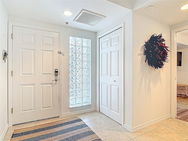 5300 S Atlantic Ave Unit 9-302, New Smyrna Beach, FL 32169 - foyer with recessed lighting, baseboards, visible vents, and light tile patterned floors