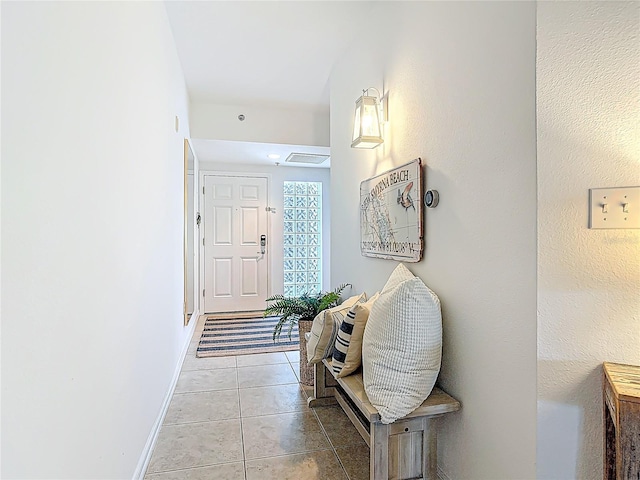 5300 S Atlantic Ave Unit 9-302, New Smyrna Beach, FL 32169 - corridor featuring baseboards and light tile patterned floors