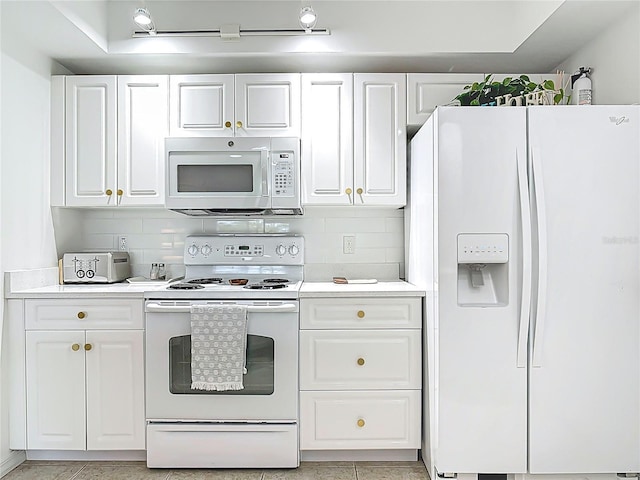 5300 S Atlantic Ave Unit 9-302, New Smyrna Beach, FL 32169 - kitchen featuring white cabinets, light countertops, and white appliances