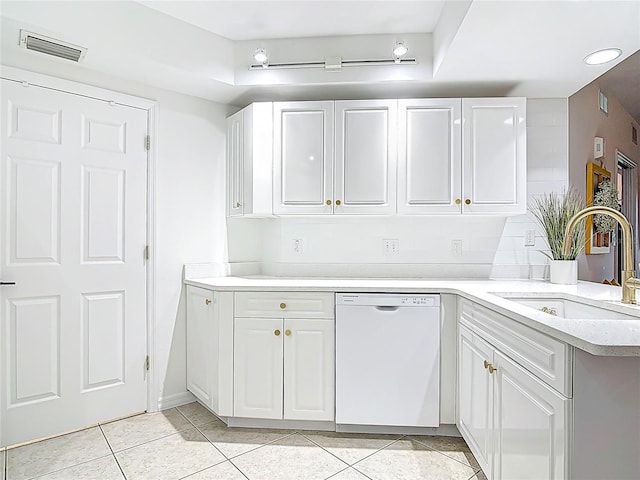 5300 S Atlantic Ave Unit 9-302, New Smyrna Beach, FL 32169 - kitchen with light countertops, dishwasher, visible vents, light tile patterned floors, and a sink