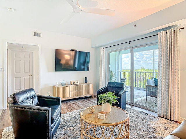 5300 S Atlantic Ave Unit 9-302, New Smyrna Beach, FL 32169 - living area featuring visible vents, light wood-style floors, and ceiling fan