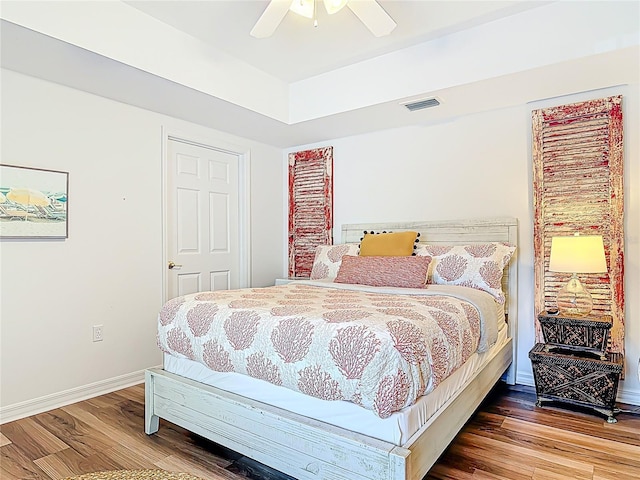 5300 S Atlantic Ave Unit 9-302, New Smyrna Beach, FL 32169 - bedroom featuring baseboards, wood finished floors, visible vents, and a ceiling fan