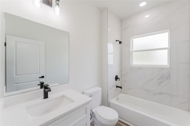 bathroom with toilet, tub / shower combination, and vanity