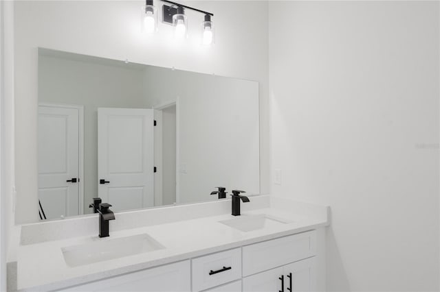bathroom with double vanity and a sink