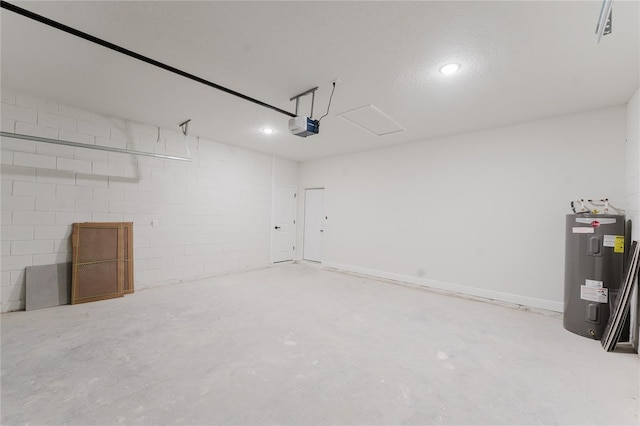 garage with visible vents, water heater, recessed lighting, a garage door opener, and concrete block wall