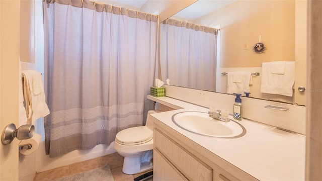 bathroom with tile patterned floors, vanity, and toilet