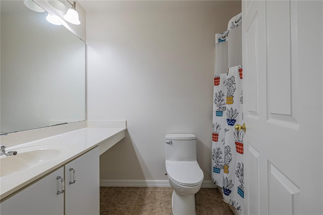 50989 Hwy 27 Unit 371, Davenport, FL 33897 - bathroom featuring toilet, vanity, tile patterned flooring, baseboards, and a shower with shower curtain