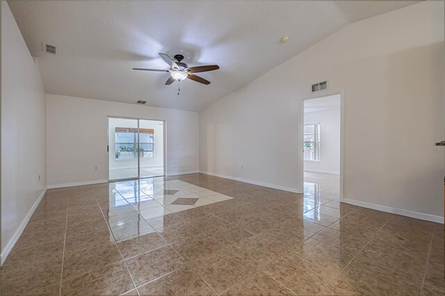50989 Hwy 27 Unit 371, Davenport, FL 33897 - tiled spare room with lofted ceiling, a ceiling fan, and baseboards