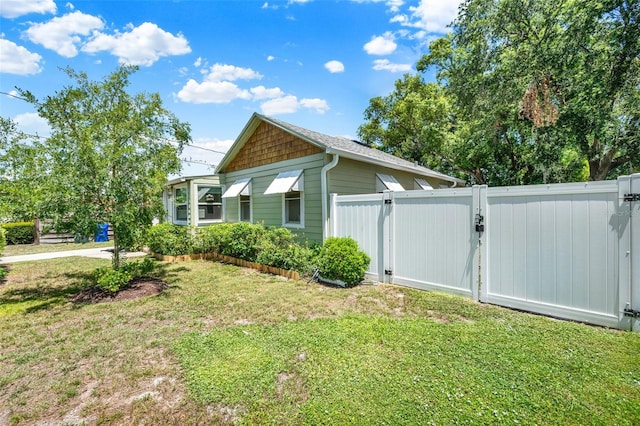 508 10th St, Saint Cloud, FL 34769 - view of side of property featuring a gate