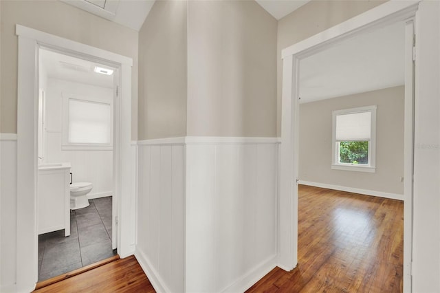 508 10th St, Saint Cloud, FL 34769 - hall featuring wood finished floors and wainscoting