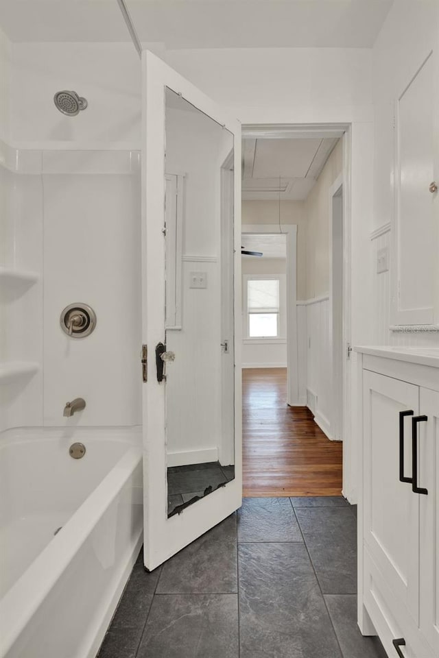 508 10th St, Saint Cloud, FL 34769 - bathroom featuring shower / washtub combination, vanity, and wainscoting