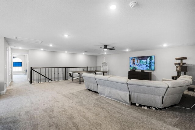4485 Renly Ln, Clermont, FL 34711 - carpeted living area with attic access, ceiling fan, and recessed lighting