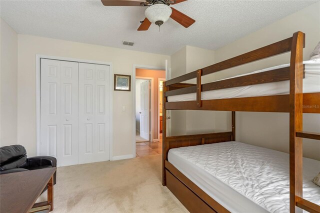 2710 Alabaster Ave, Orlando, FL 32833 - bedroom with light carpet, a textured ceiling, visible vents, a closet, and ceiling fan