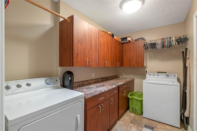 2710 Alabaster Ave, Orlando, FL 32833 - laundry area featuring washer and clothes dryer, a textured ceiling, and cabinet space