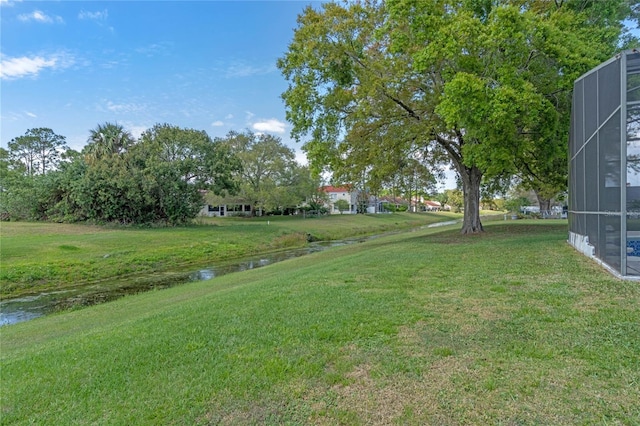 2710 Alabaster Ave, Orlando, FL 32833 - view of yard featuring a lanai and a water view