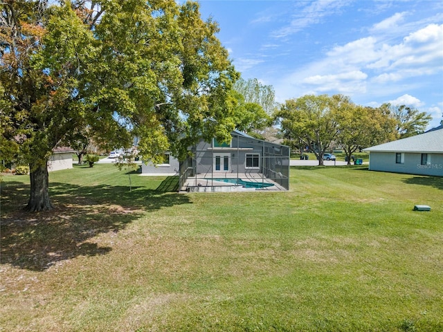 2710 Alabaster Ave, Orlando, FL 32833 - view of yard featuring an outdoor pool and glass enclosure