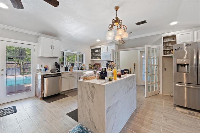 kitchen featuring open shelves, visible vents, white cabinetry, and stainless steel appliances