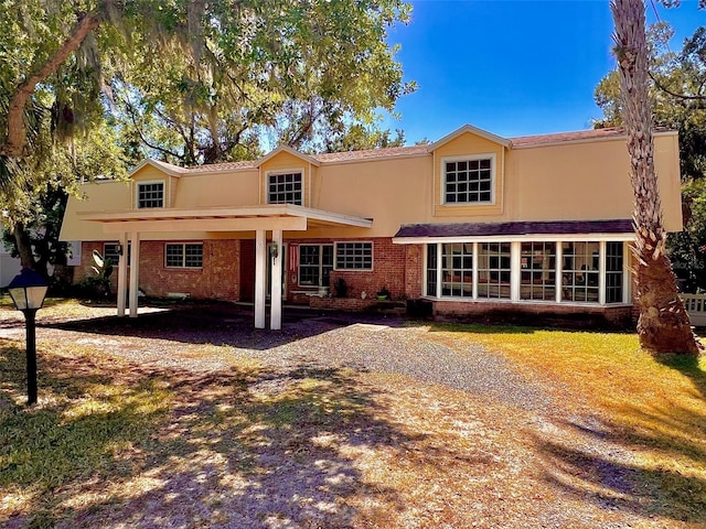 76 Oakdale St, Windermere, FL 34786 - back of property with stucco siding and brick siding