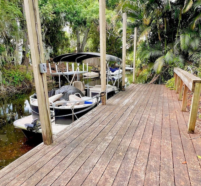 76 Oakdale St, Windermere, FL 34786 - view of dock featuring boat lift and a water view