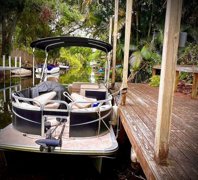 76 Oakdale St, Windermere, FL 34786 - view of dock featuring fence and a deck