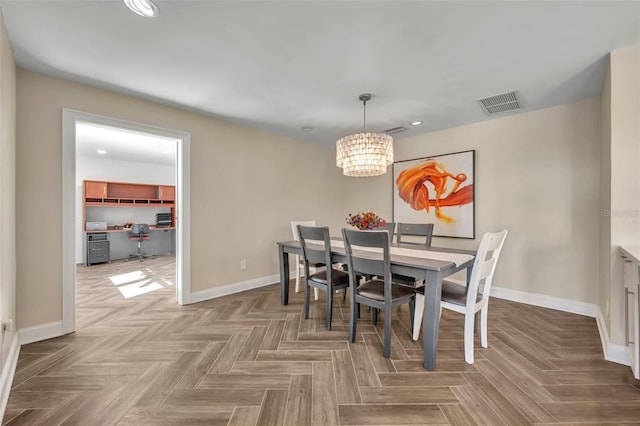 1003 Shore Dr, Kissimmee, FL 34744 - dining area with recessed lighting, baseboards, visible vents, and an inviting chandelier
