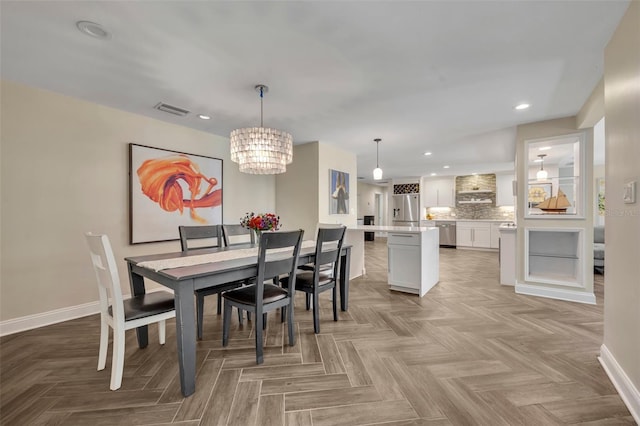 1003 Shore Dr, Kissimmee, FL 34744 - dining space featuring baseboards, a notable chandelier, recessed lighting, and visible vents
