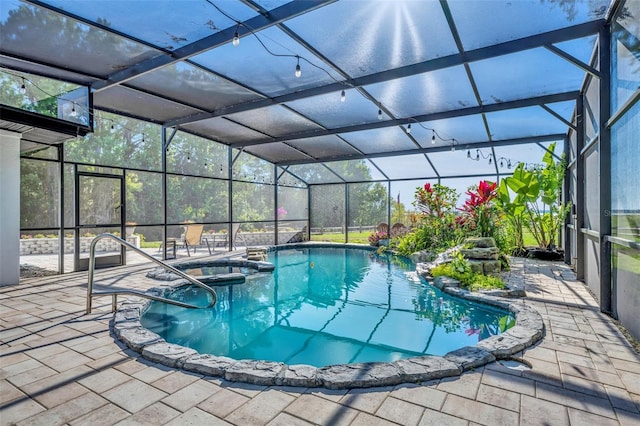 1003 Shore Dr, Kissimmee, FL 34744 - view of pool featuring glass enclosure, a patio, and a pool with connected hot tub