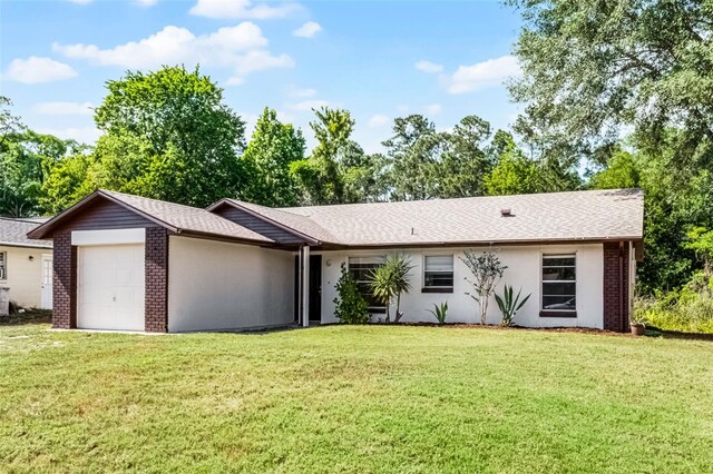 288 Howard Blvd, Longwood, FL 32750 - single story home with an attached garage, a shingled roof, stucco siding, and a front yard