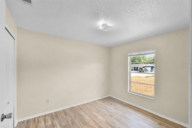 288 Howard Blvd, Longwood, FL 32750 - empty room featuring baseboards, a textured ceiling, light wood finished floors, and visible vents