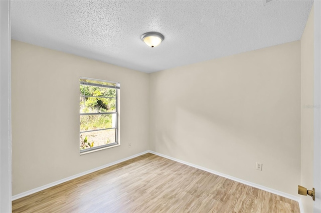 288 Howard Blvd, Longwood, FL 32750 - empty room featuring a textured ceiling, baseboards, and light wood-style flooring