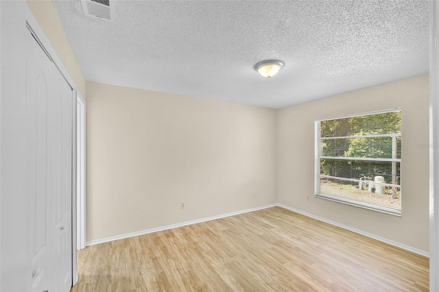 288 Howard Blvd, Longwood, FL 32750 - empty room featuring light wood-style floors, baseboards, a textured ceiling, and visible vents