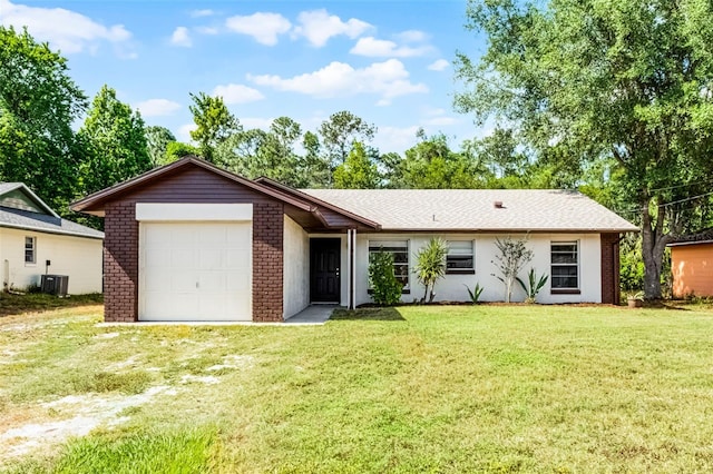 288 Howard Blvd, Longwood, FL 32750 - ranch-style home featuring brick siding, an attached garage, central AC unit, and a front lawn