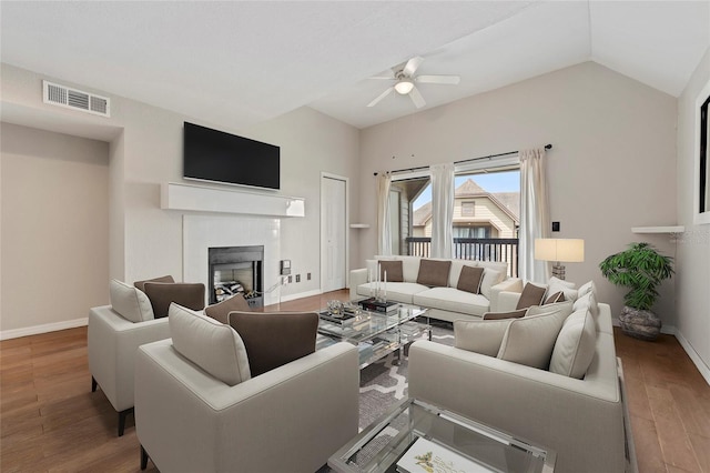 390 Lake Placid Ct Unit 304, Altamonte Springs, FL 32701 - living area featuring baseboards, visible vents, wood finished floors, ceiling fan, and a tile fireplace