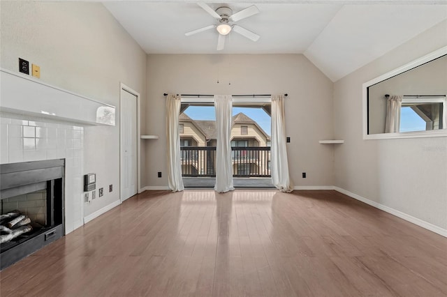 390 Lake Placid Ct Unit 304, Altamonte Springs, FL 32701 - unfurnished living room with a tiled fireplace, wood finished floors, baseboards, and ceiling fan