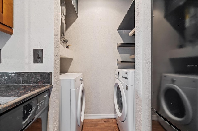 390 Lake Placid Ct Unit 304, Altamonte Springs, FL 32701 - laundry area featuring washer / dryer, wood finished floors, and laundry area