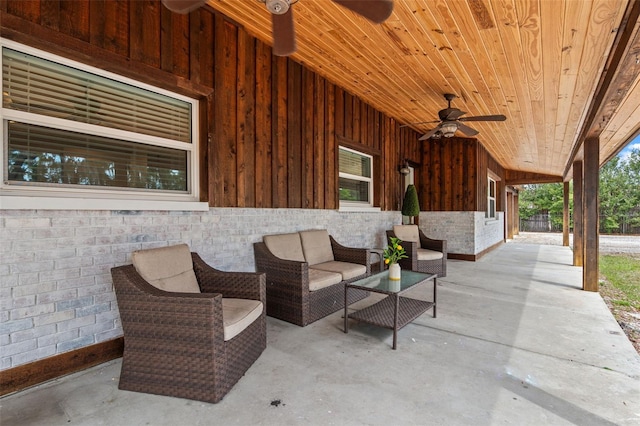 view of patio with outdoor lounge area and a ceiling fan