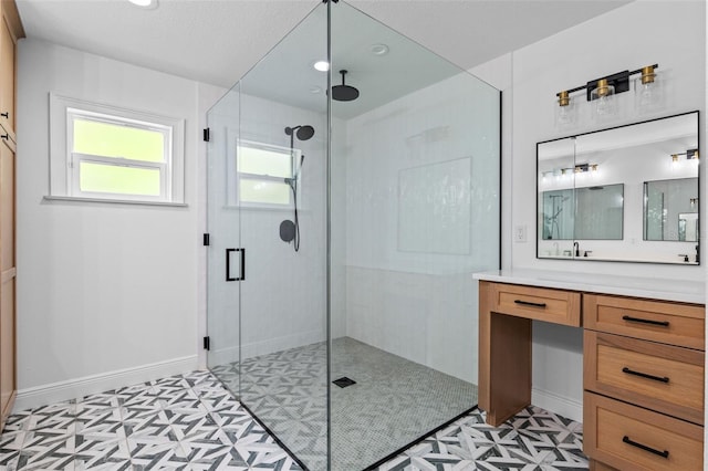 bathroom featuring a shower stall, vanity, tile patterned floors, and recessed lighting