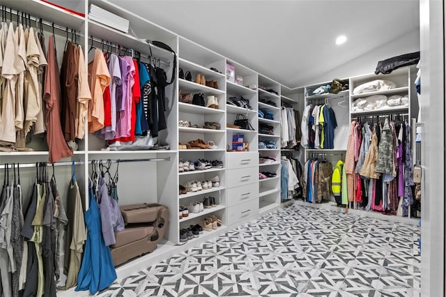 spacious closet featuring lofted ceiling and tile patterned floors