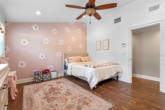 bedroom featuring baseboards, wood finished floors, visible vents, and wallpapered walls
