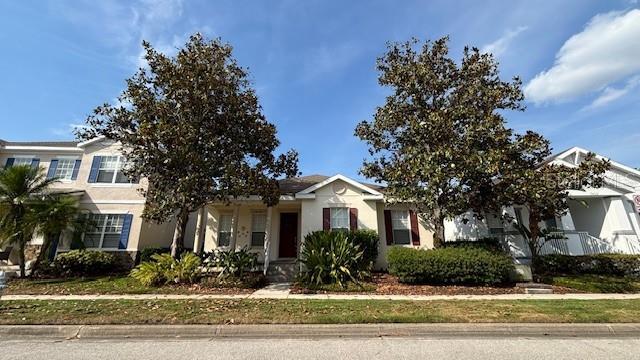 7415 Devereaux St, Reunion, FL 34747 - view of front of house featuring stucco siding