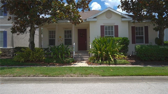 7415 Devereaux St, Reunion, FL 34747 - view of front of property with stucco siding